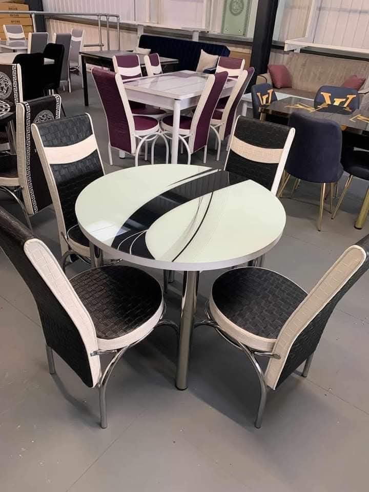 Round Glass Dining Set — 4 Monochrome Chairs
